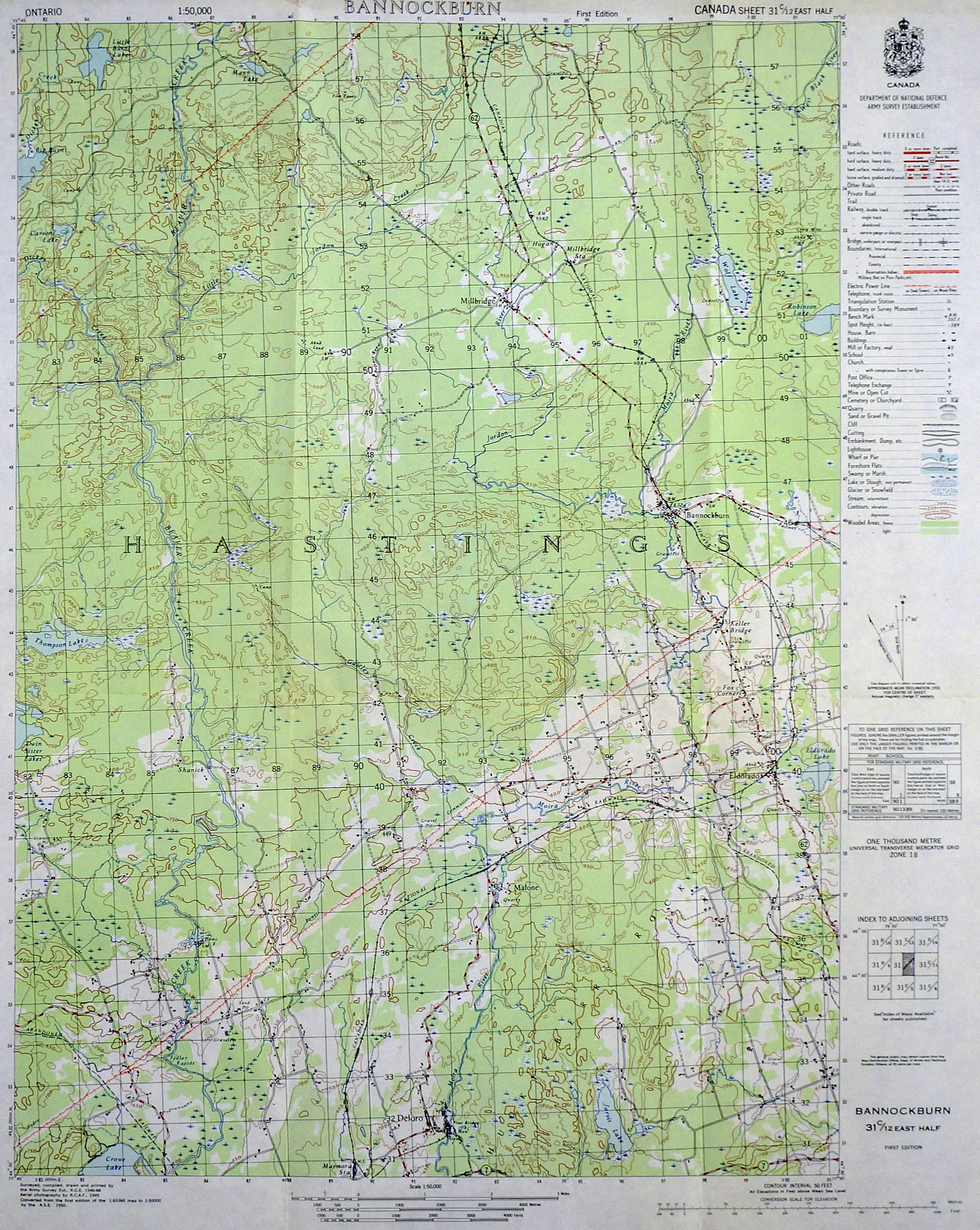 Topographic map of a rural area with roads, streams, and contour lines, laid out flat on a surface